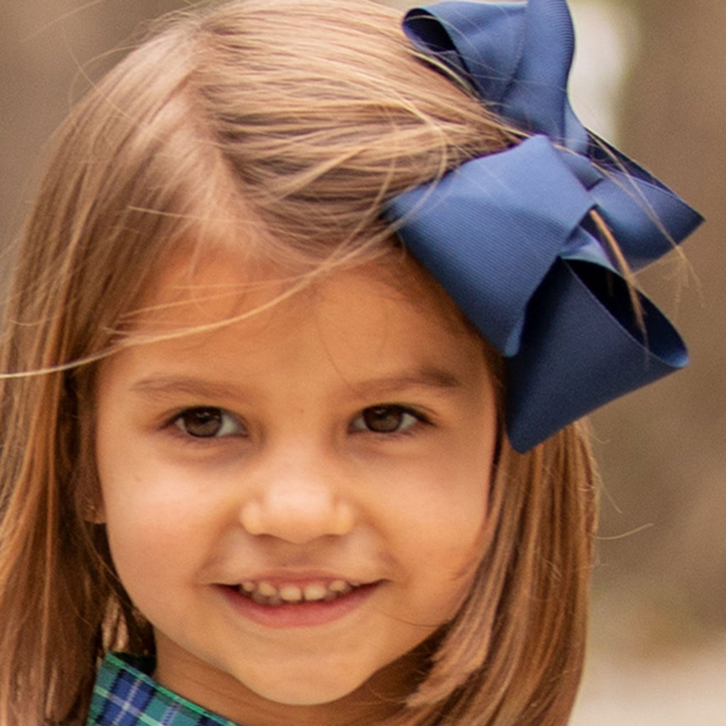 little girl wearing a Navy Biggie Bow