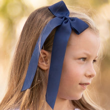 Load image into Gallery viewer, little girl wearing a Navy Birdie Bow
