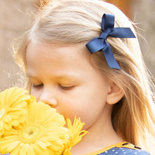 Load image into Gallery viewer, little girl wearing a Navy Bitty Bow