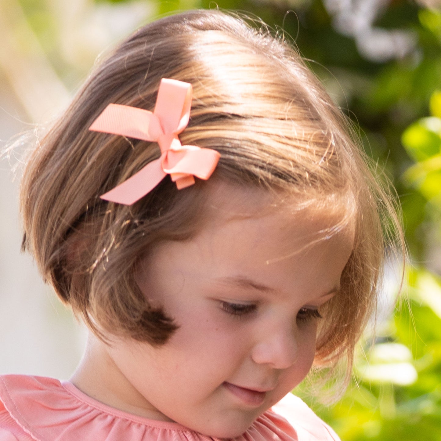 little girl wearing a Peaches Bitty Bow