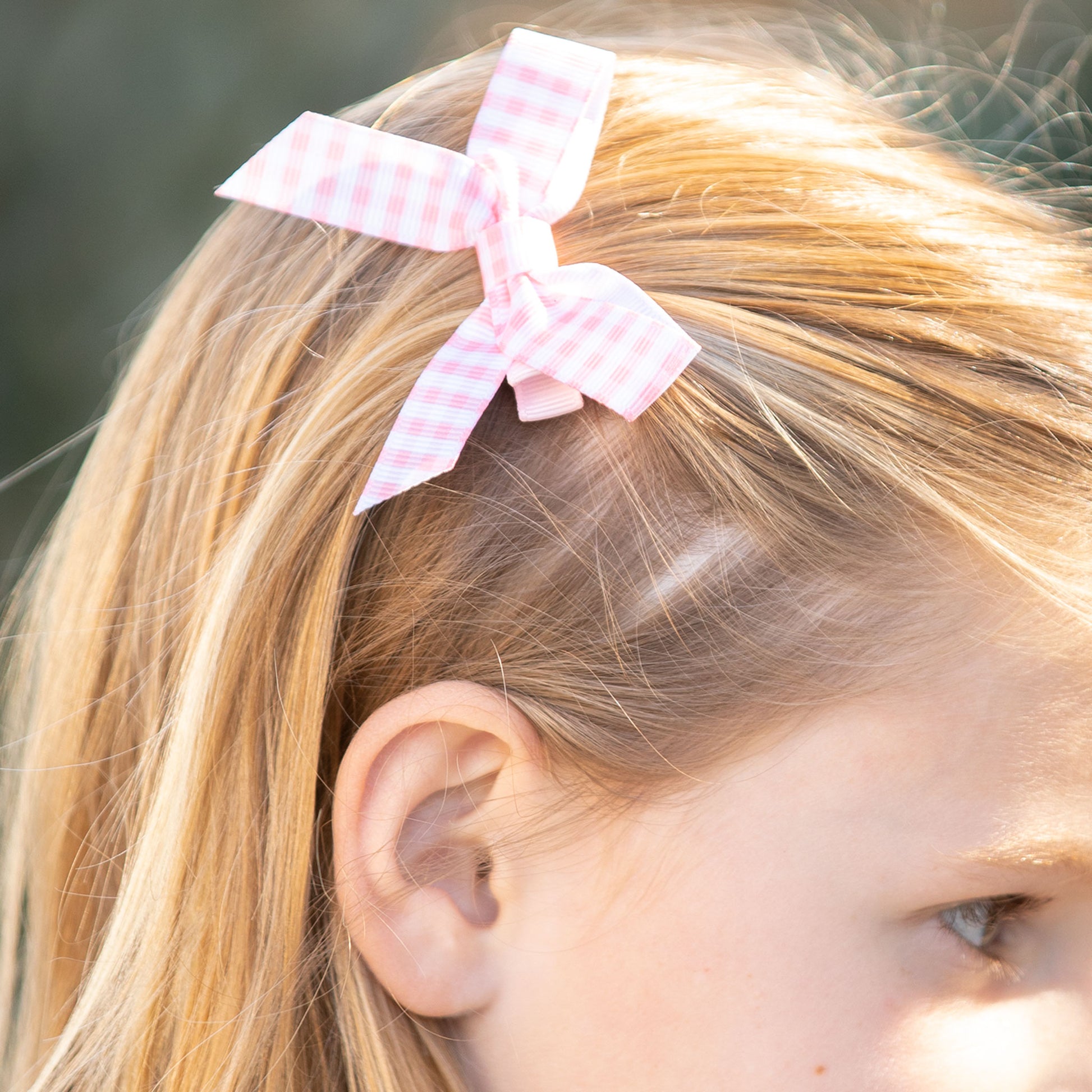 little girl wearing a Pink Check Biggie Bow
