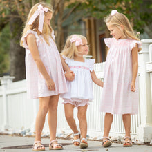 Load image into Gallery viewer, little girl wearing Petit Rose Smocked Bishop with two other little girls walking down the sidewalk