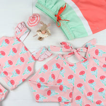 Load image into Gallery viewer, flatlay of La Fleur One-Piece Rash Guard and other children&#39;s swimwear