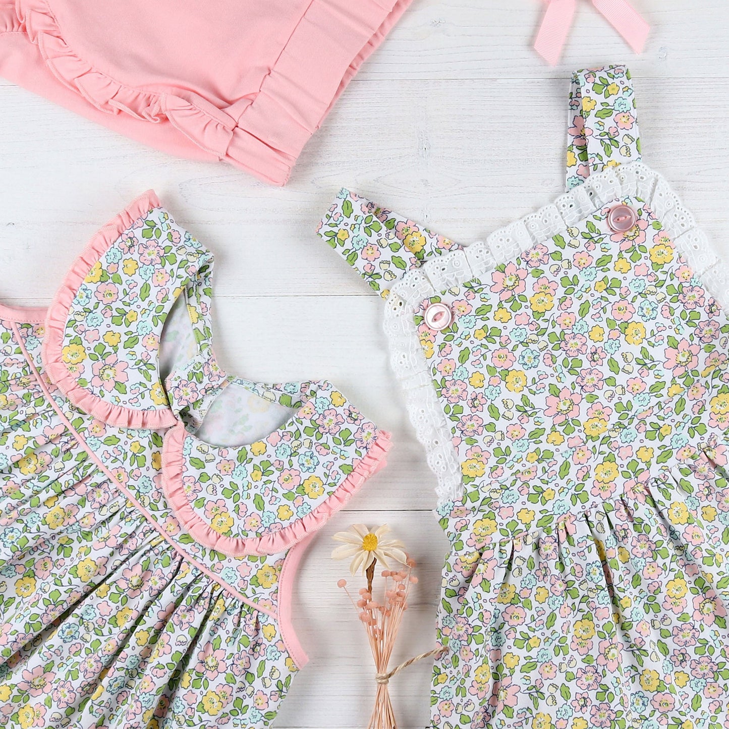 flatlay of Tybee Floral Romper and coral shorts