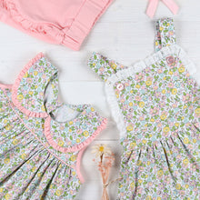 Load image into Gallery viewer, flatlay of Tybee Floral Romper and coral shorts