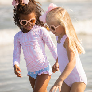 2 little girls playing at the beach