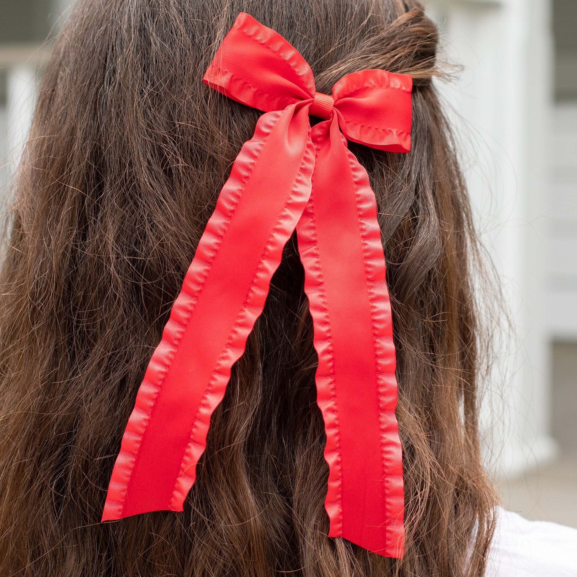 little girl wearing a Red Curly Hair Bow