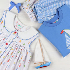 flatlay of childrens summer clothing