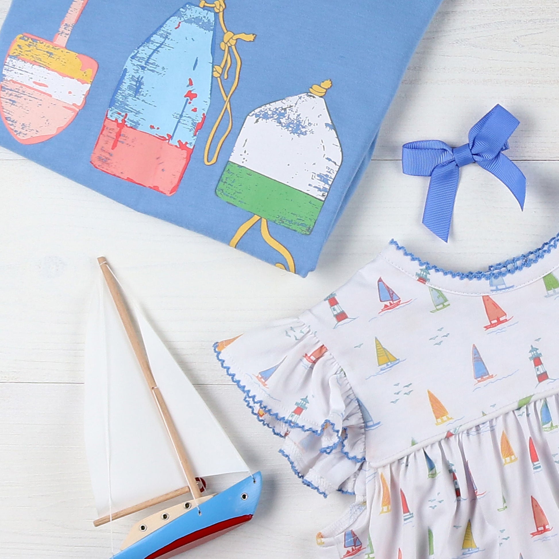 flatlay of childrens summer clothing