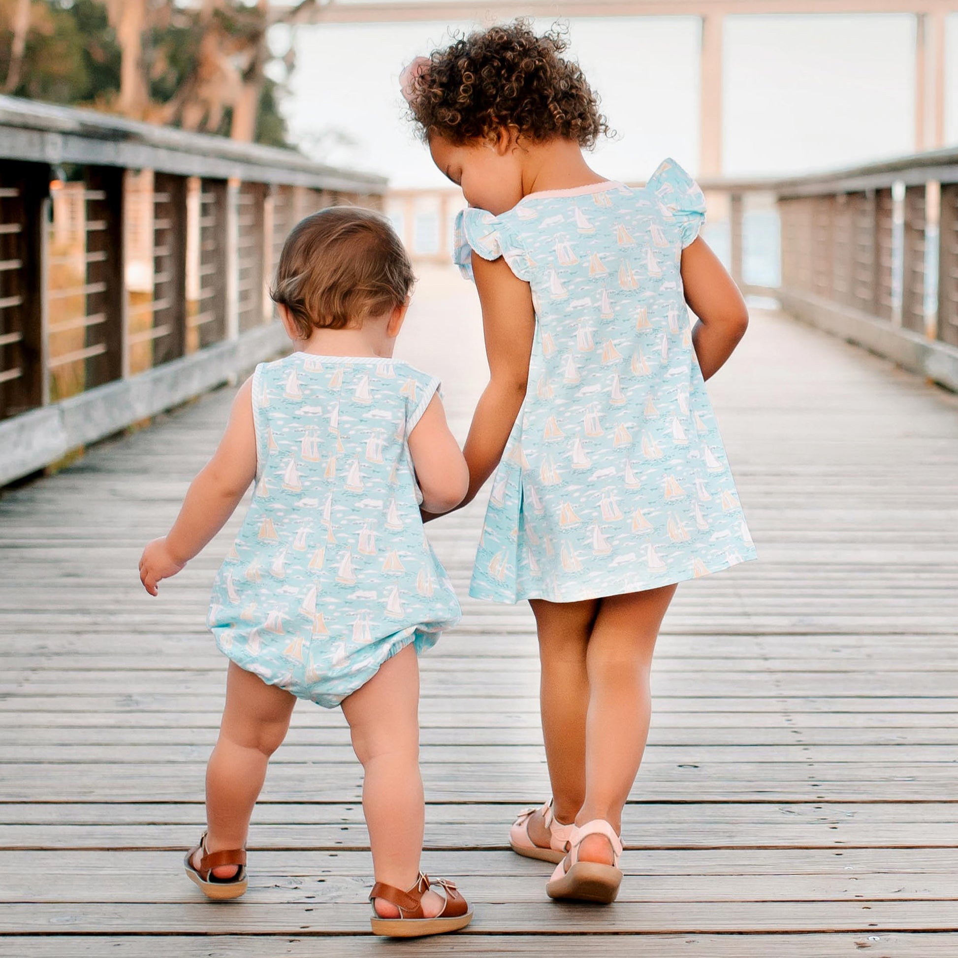 little girl and little boy holding hands