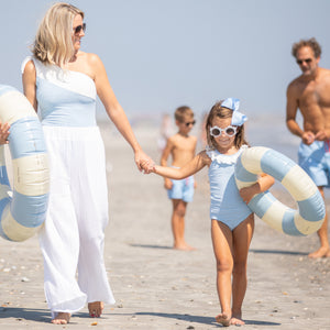 family at the beach with little girl wearing Girls Light Blue Skye Tankini