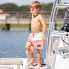 Load image into Gallery viewer, little boy wearing Sorbet Swim Boardies on the boat