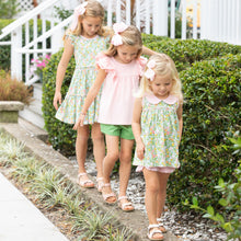 Load image into Gallery viewer, little girl wearing Orange Blossom Tier Dress walking on the ledge of the sidewalk with her sisters