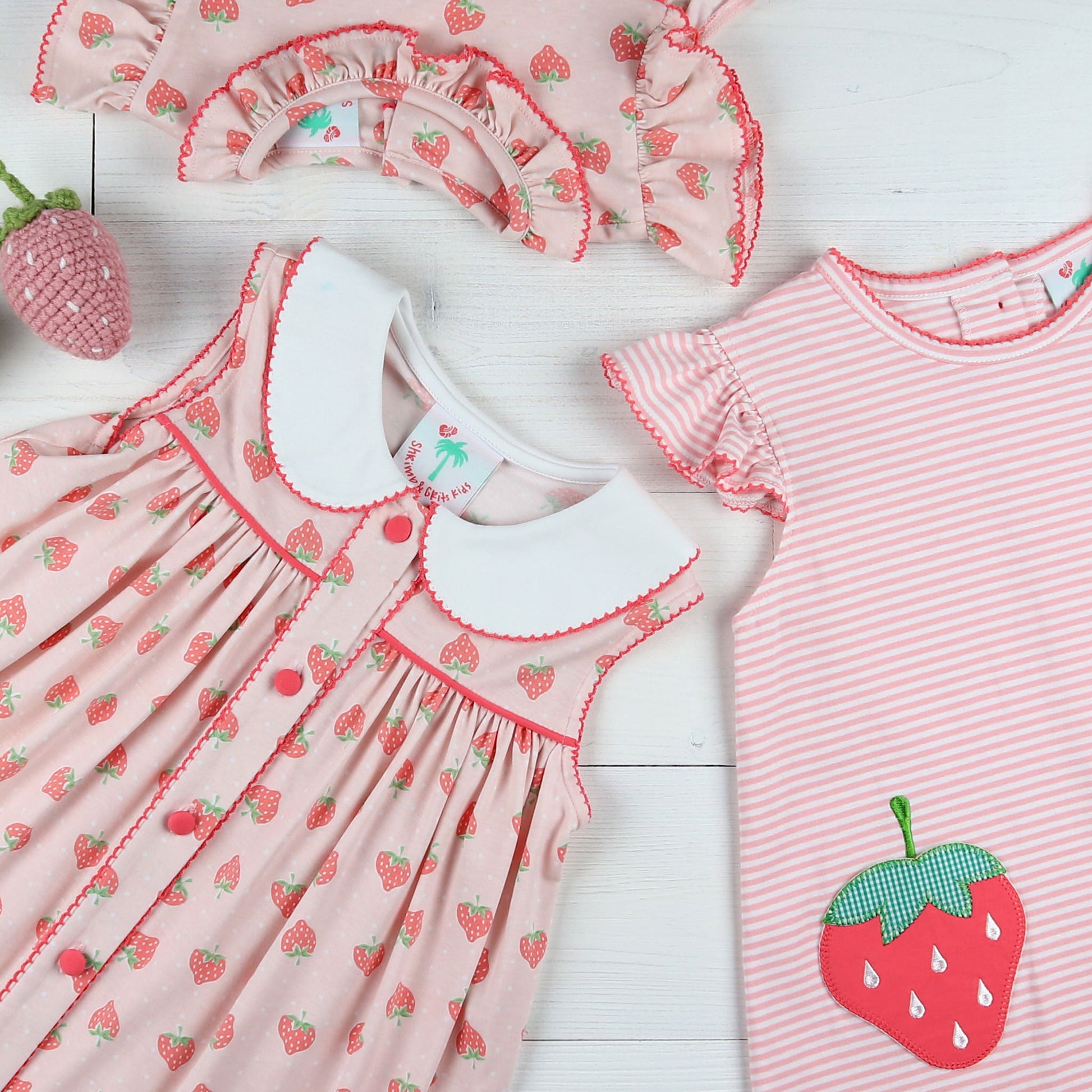 flatlay of Strawberry Pickin’ Bubble, and dress