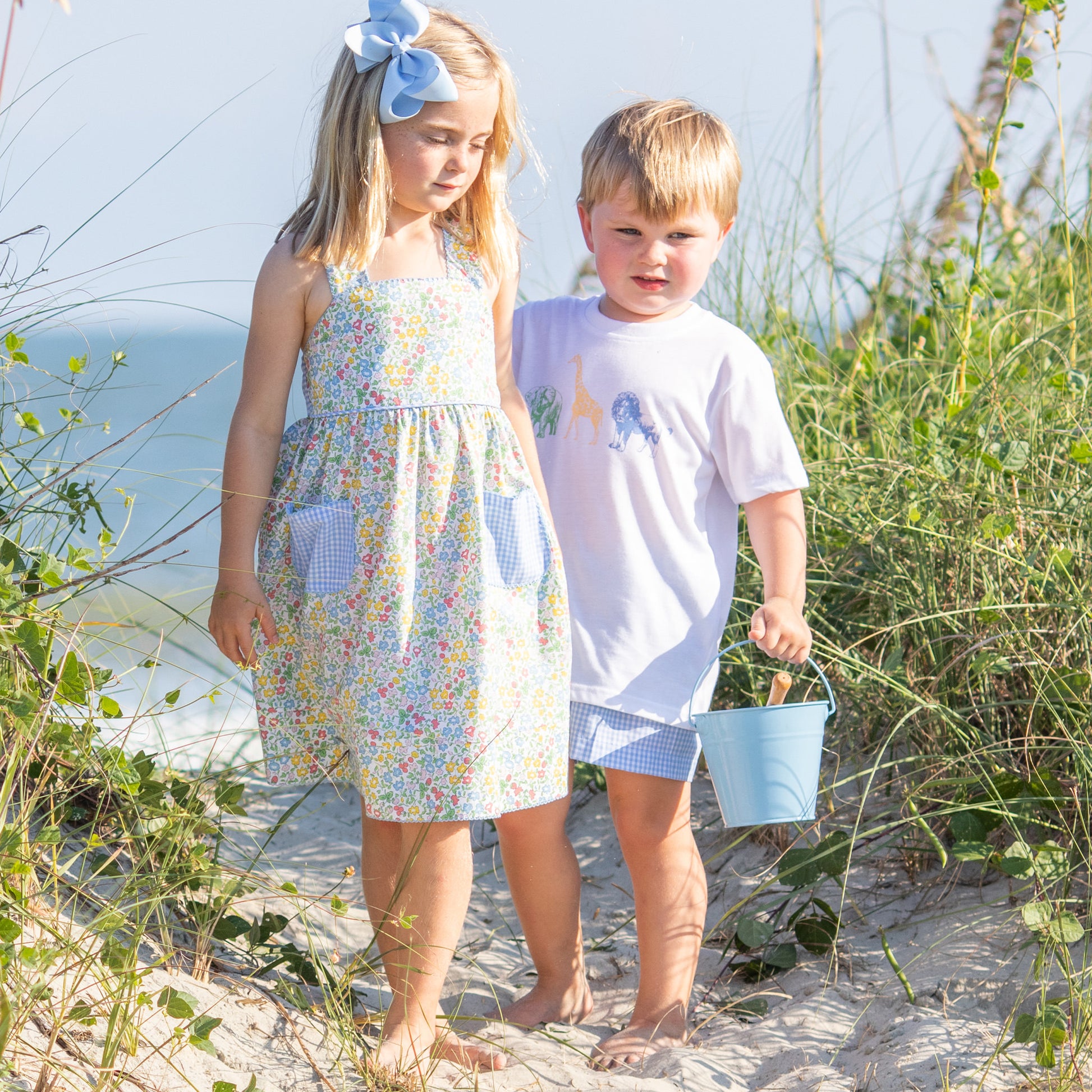 little girl and little boy wearing Short Sleeve Safari Graphic Tee at the beach