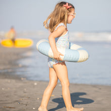 Load image into Gallery viewer, little girl playing at the beach in blue striped floaty