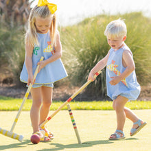 Load image into Gallery viewer, little boy and little girl wearing blue checked giraffe clothing playing croquet