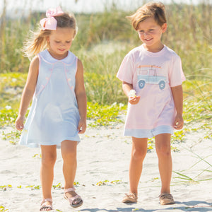 little boy wearing Botany Bay Stripe Shorts and walking down the beach with a little girl