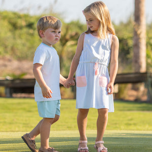 little boy holding little girl's hand who's wearing Tennis Club Jordan Dress